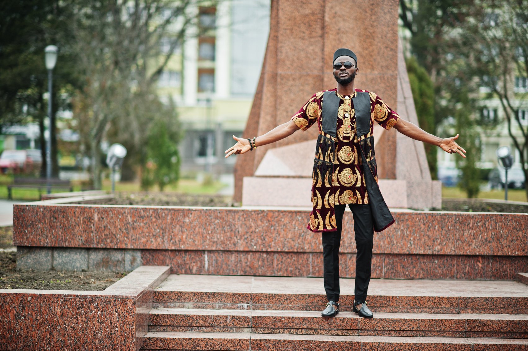 African stylish and handsome man in traditional outfit, sung